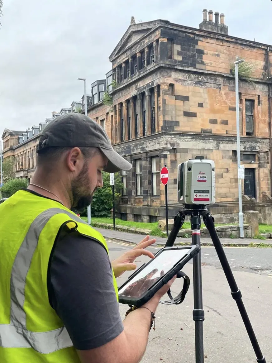 Connor Milton MCIAT running a Leica RTC360 laser scan of a sandstone villa in Glasgow's West End