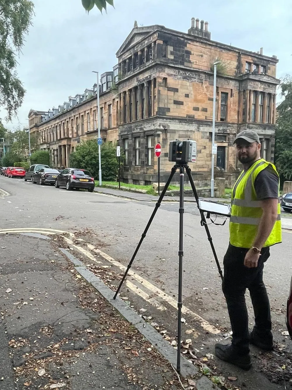 Leica RTC360 laser scanner set up outside a sandstone terrace in Glasgow's West End for a measured building survey